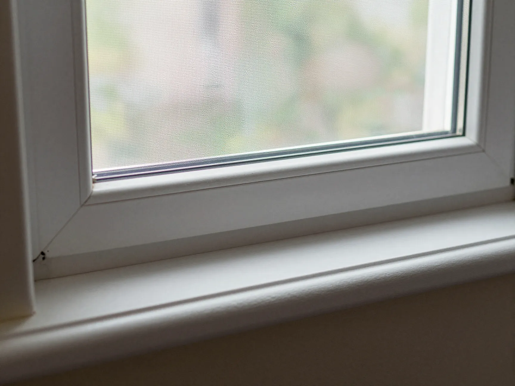 Window sill with interior detail and insect screen mesh close-up, ,